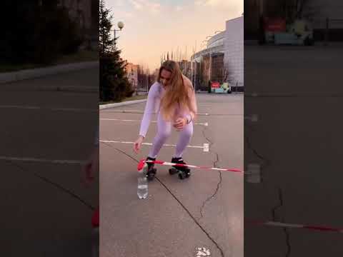 blonde doing lowest limbo rollers skating