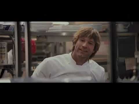 Official trailer frame: Chef Kate and sous-chef Nick back-to-back in a warmly lit Manhattan kitchen