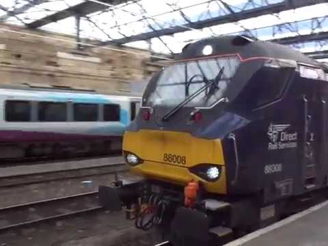 The Class 88 DRS No.88008 'Ariadne' with Rail Containers was passing at Carlisle Citadel Station.