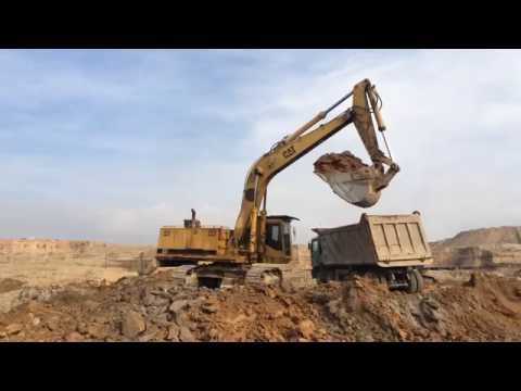 Caterpillar 245B Excavator Loading Truck