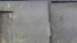 shane double missile dropkick into steel door