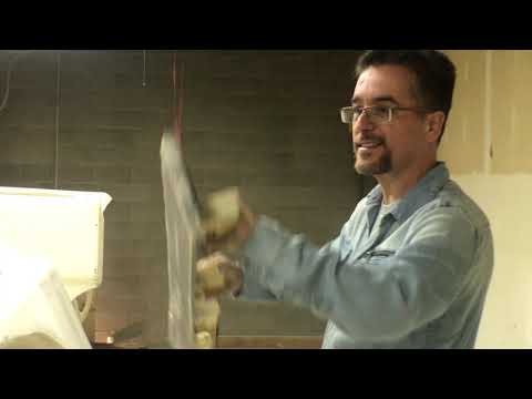 Man building own catamaran