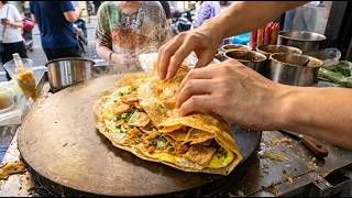 How This Chinese Street Food Master Folds a Giant Savory Crepe in Seco
