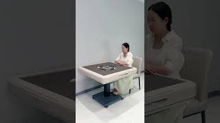 This is an automatic mahjong table. Automatic captions foldable table philosophy opereting system
