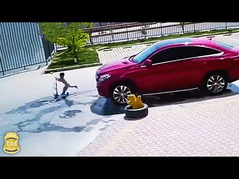 Dashcam footage: child on a scooter falls under an oncoming car