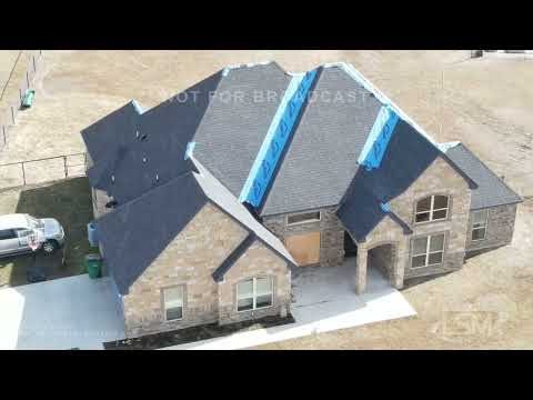 02-22-2022 New Fairview, TX - Residents spend the morning cleaning up hail damage