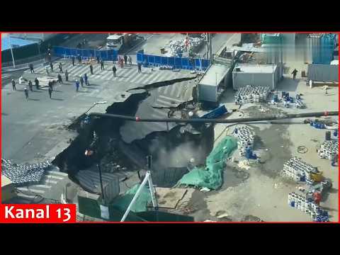 Dramatic video shows moments of huge sinkhole swallowing a road in Shanghai, China