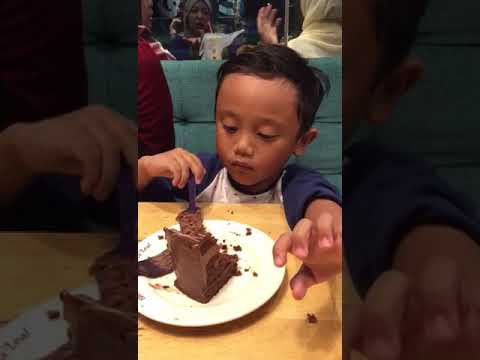 Adam Fayyaz eating cake