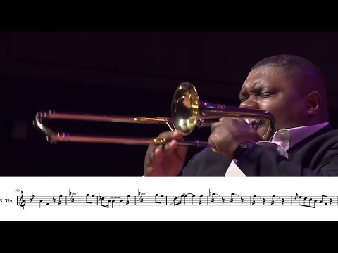 big man plays tiny trambone