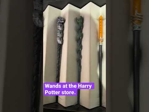 Looking at wands at the Harry Potter store…