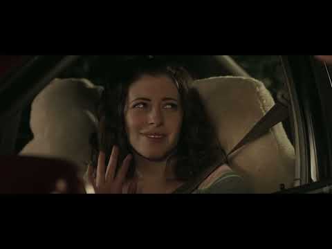 Promotional trailer frame: the two leads plotting their phone business
