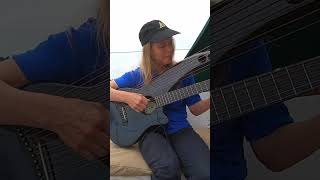 Muriel Anderson with the #EmeraldGuitars Synergy X7 #HarpGuitar