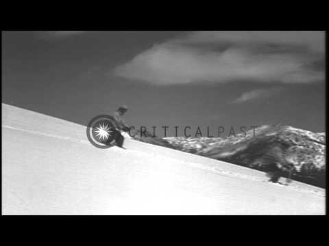 Men demonstrate the snow plow position and the slowing down of the speed while sl...HD Stock Footage