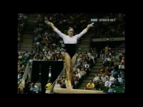 Lisa Clark (Auburn) shows TWO LAYOUTS and a DOUBLE TUCK for 9.825 on beam at the 2002 SECS