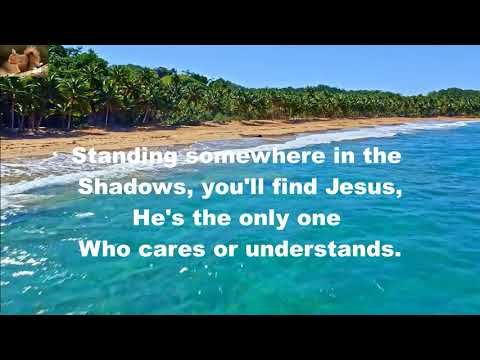 Standing somewhere in the shadows