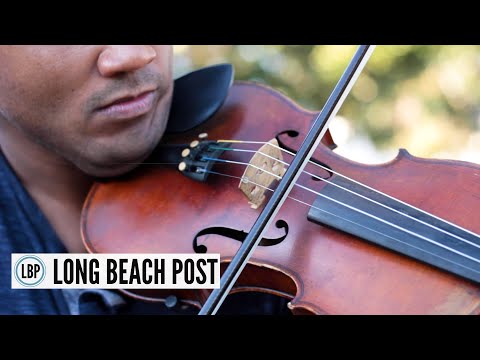 Violinist Jordan Busa plays outdoor, 'porch-side' concerts for people