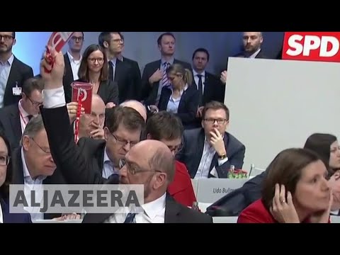 🇩🇪 Germany's SPD votes for coalition talks with Merkel