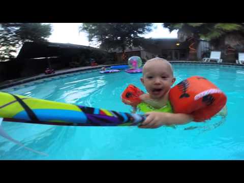 Baby in Swimming Pool. Stearns Kids' Shark Puddle Jumper Life Jacket