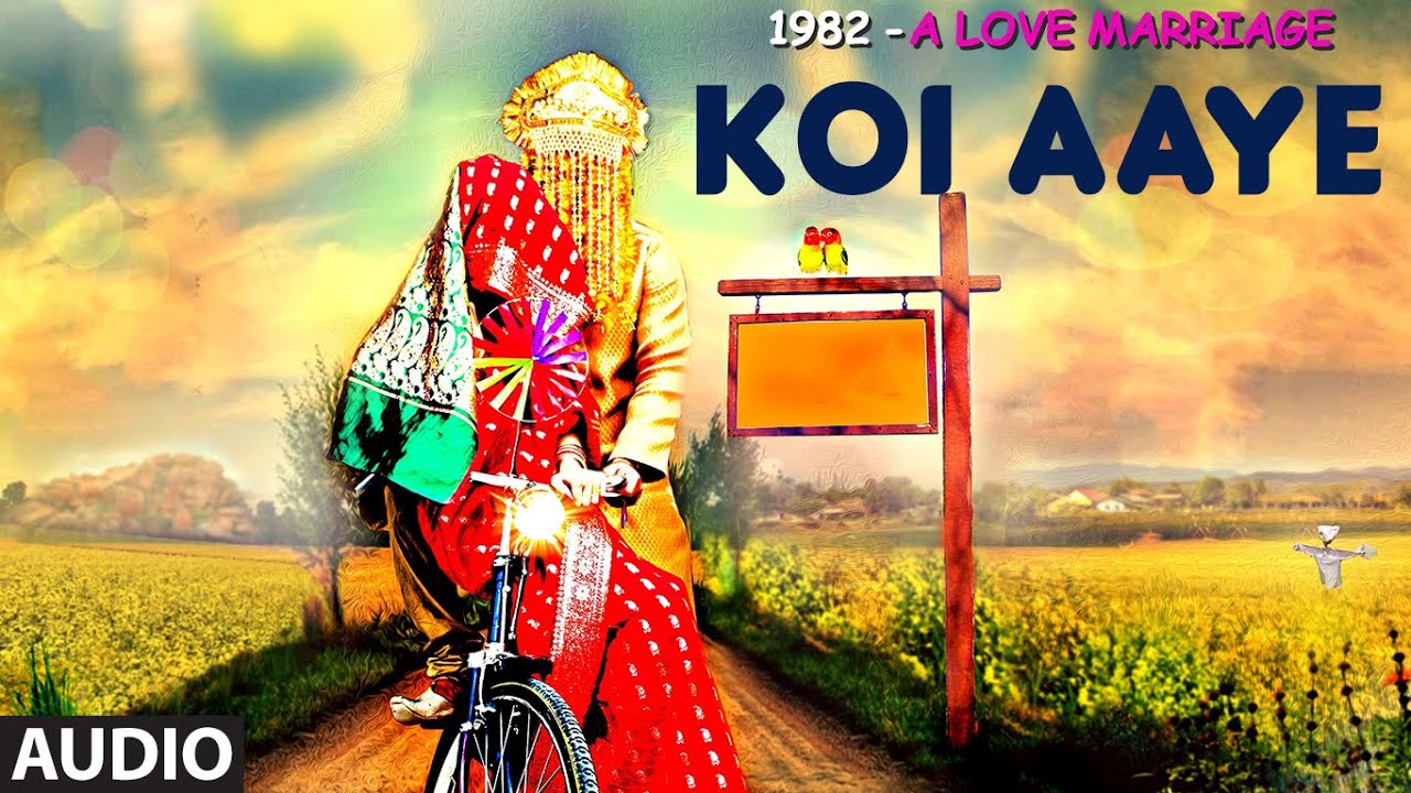 Koi Aaye Lyrics  | 1982 – A Love Marriage | Amit Kumar Sharma, Omna Harjani | Javed Ali, Kirti Killedar | Anurag Sharma, Chinmay