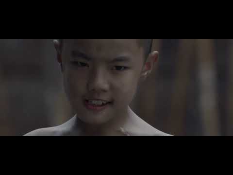 Audience POV: end-credits calligraphy slashes across red-black panels as analog synth pulses