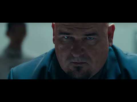 Ninja Assassin trailer still: rain-lashed rooftop as Raizo whips a chained blade through neon mist