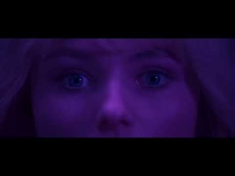 Trailer still: Eloise facing the mirror as Sandie’s silhouette overlays her reflection