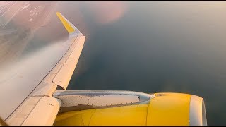 Vueling A320 Takeoff from Barcelona Airport with condensation wing