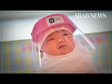 Newborns given tiny face shields at a Bangkok hospital