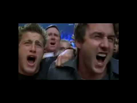Ready to Rumble (2000) trailer frame — arena lights flare as Jimmy King stares down the hard camera, guitar riffs revving