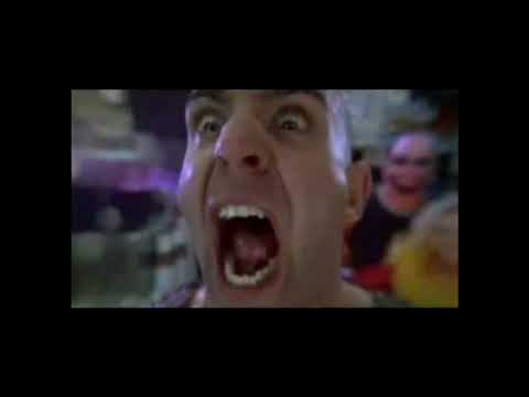 Trailer montage — training wipeouts, backstage corridors, and the triple-cage looming while guitars hammer