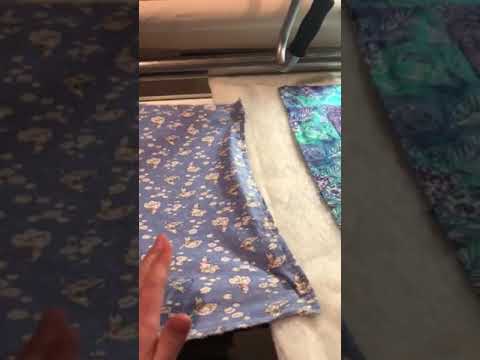 Side clamps on longarm machine