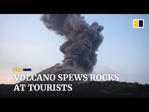 Indonesia’s Krakatoa volcano spews rocks at tourists