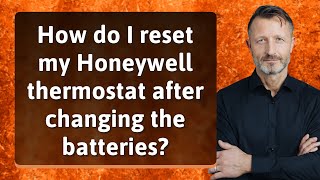 How do I reset my Honeywell thermostat after changing the batteries