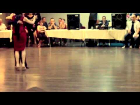  Adrian Costa  and  Amanda Costa  are  dancing  to  a  milonga