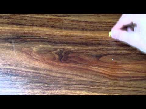 Remove hardwood floor scratches with a walnut