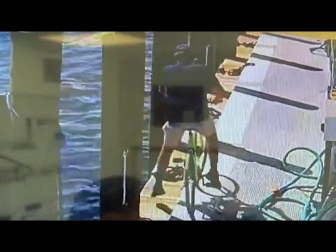 Guy riding bike falls off dock into water