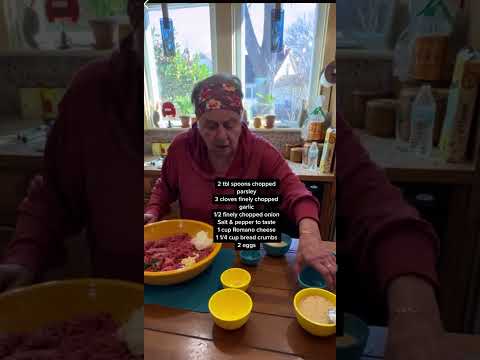 Granny makes meatballs and sauce. Italian style meatballs