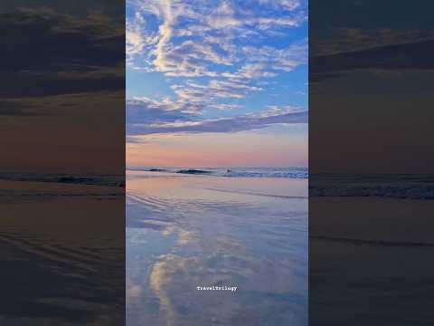 Savor a serene Sunday morning with the breathtaking sunrise at the beach and the soothing waves.