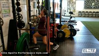Elite Fastpitch Athlete performing a set of Barbell Front Split Squats