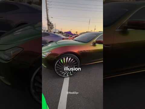 Why Do This Car's Wheels Appear Motionless While Driving?🚙🤔