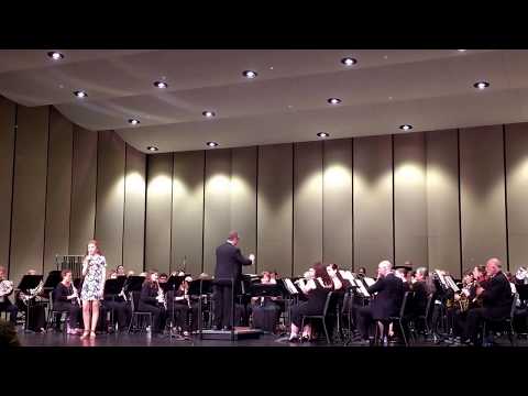 The Lexington Community Band performs "The Star Spangled Banner" featuring Ms. Jessie Miller, vocal.