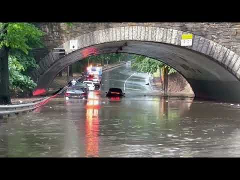 Flash flooding in New York City traps cars underneath bridge