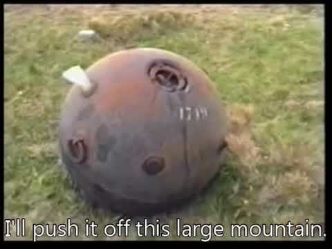Pushing a naval mine off a mountain