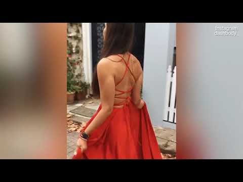 Bachelor babe Dasha Gaivoronski falls over while modelling red dress