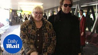 Tom Jones walks through Heathrow Airport with wife Linda in 1991 - Daily Mail
