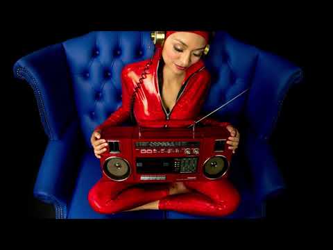 Cute woman in a chair holding a retro ghettoblaster - Disco House Music