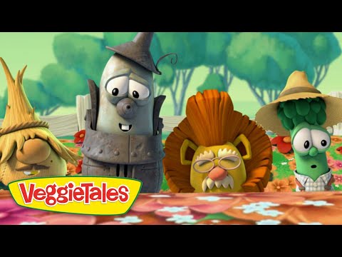 Animated VeggieTales characters stand behind a flower-filled table in a sunny garden; colorful logo in front.