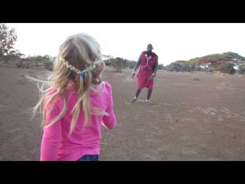 4 year old and Masai man playing with giraffe droppings (Kenya 2013)