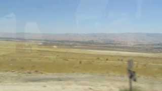 preview picture of video 'A drive from the Dead Sea through the Jordan Valley to the Sea of Galilee (overlooking the Jordan).'