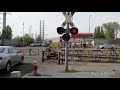China Railway Cargo Train Railway Crossing In Heavy City Traffic